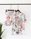 Women's Floral print short-sleeve pajama set crafted from soft viscose fabric, featuring a turn-down collar and elastic waist pants for breathable comfort from lazy evenings to restful mornings.