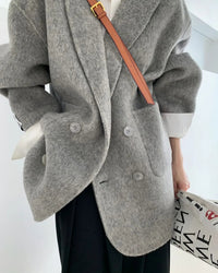 Crafted for an elegant yet relaxed wardrobe, this wool coat offers a softly textured hand feel and a clean suit inspired shape.