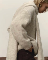 A Loose Soft V-Neck Sweater With A Scarf