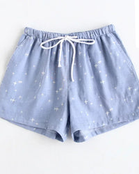 Women's Cotton star-print sleep shorts featuring an elastic drawstring waist and relaxed straight leg, crafted for breathable comfort with a whimsical print that moves seamlessly from lazy mornings to breezy evenings.