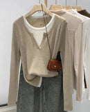 A cotton-blend knit pullover with a faux two-piece design, O-neck and slight stretch, designed for cozy layered style that transitions from day to evening.