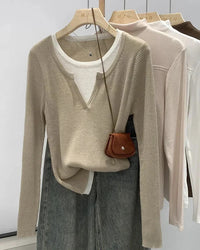 A cotton-blend knit pullover with a faux two-piece design, O-neck and slight stretch, designed for cozy layered style that transitions from day to evening.