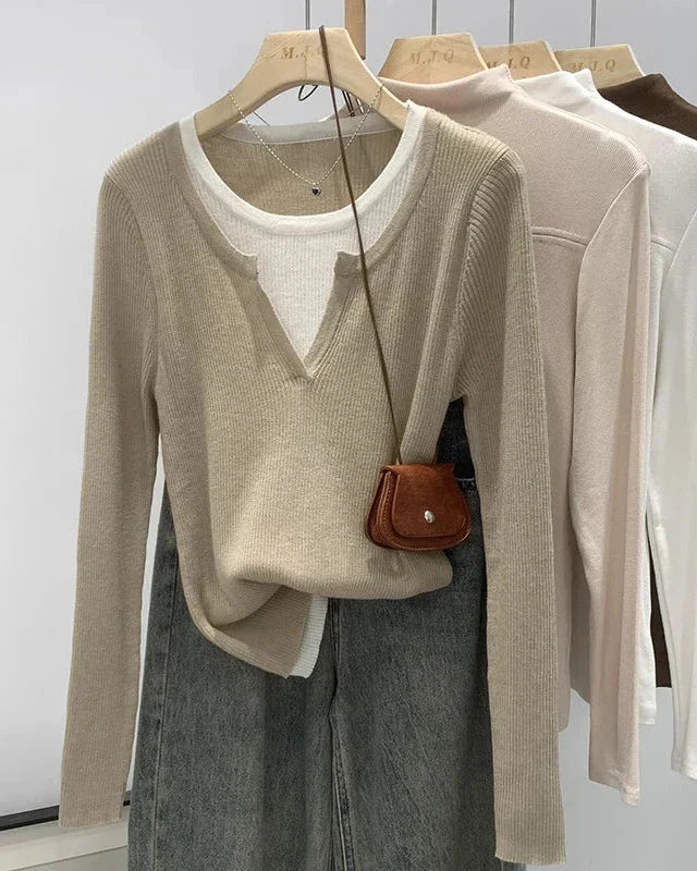 A cotton-blend knit pullover with a faux two-piece design, O-neck and slight stretch, designed for cozy layered style that transitions from day to evening.