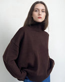 An oversized heavyweight knit pullover featuring a turtleneck, a relaxed silhouette, and a straight sleeve for effortless layered warmth.