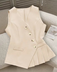 V-neck sleeveless peplum vest with asymmetric gold button closure, side pocket and pleated hem. Tailored polyester blend — polished office-to-casual style.