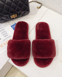 A pair of cozy fuzzy house slippers featuring a soft flannel upper and a durable PVC sole, designed to provide ultimate warmth and comfort for indoor relaxation.