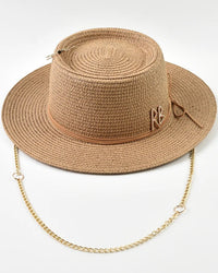 Women's Ribbon-Trim straw sun hat featuring a wide brim and lightweight paper-straw weave, designed for breathable UV protection and elegant resort wear styling.