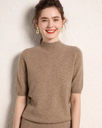A cashmere half-sleeve mock-neck sweater with mock neck, half sleeves, regular fit and stretch, designed for a cozy winter layering look that pairs from sneakers to boots.