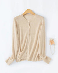 Women's loose-fitting crew-neck single-breasted cardigan, featuring a relaxed silhouette and classic knit design for effortless spring and summer layering.