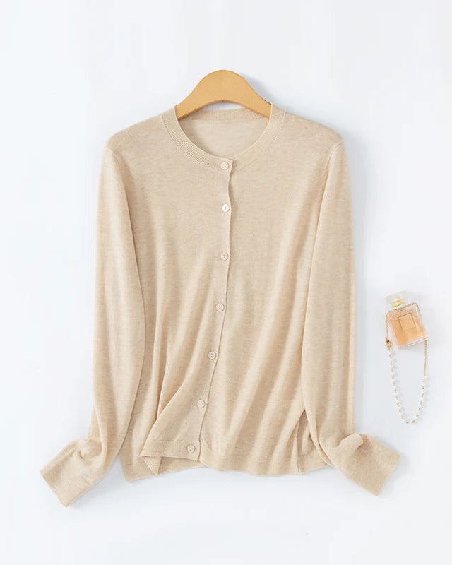Women's loose-fitting crew-neck single-breasted cardigan, featuring a relaxed silhouette and classic knit design for effortless spring and summer layering.