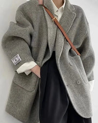 Crafted for an elegant yet relaxed wardrobe, this wool coat offers a softly textured hand feel and a clean suit inspired shape.