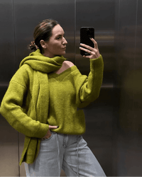 A Loose Soft V-Neck Sweater With A Scarf