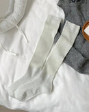 Soft knit thigh-high socks. Breathable cotton blend, all-day comfort, minimal design.