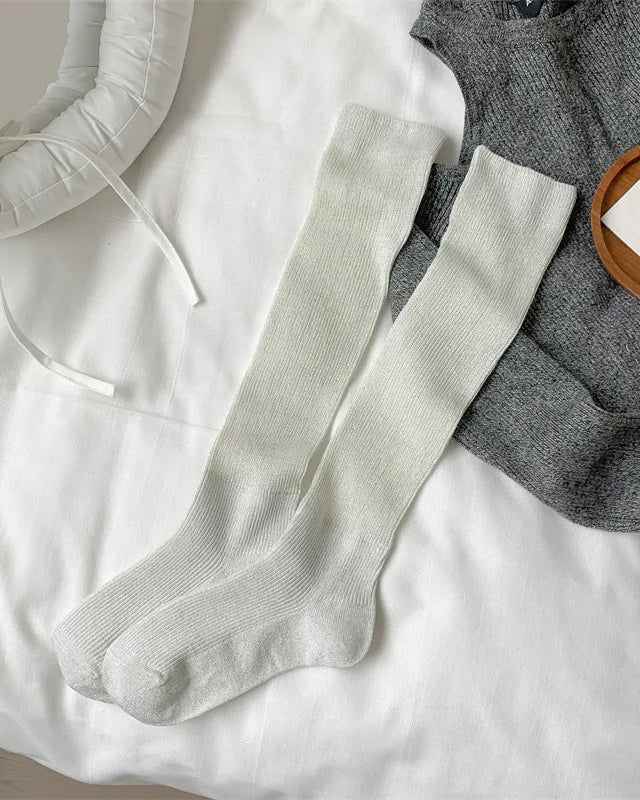 Soft knit thigh-high socks. Breathable cotton blend, all-day comfort, minimal design.