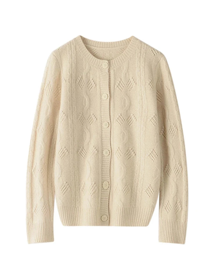 A 100% Australian merino wool openwork cardigan with an O-neck and button front, designed for poised vintage warmth that layers easily from commute to dinner.
