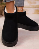 A pair of slip-on snow ankle boots featuring a soft flannel upper, a cozy warm lining, and a durable rubber outsole for comfortable winter wear.