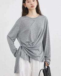 Quiet ease in its simplest form. The fabric falls softly from the shoulders, lending a gentle drape to a relaxed silhouette.