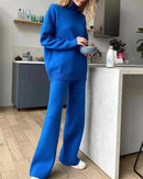 Half-turtleneck knit sweater and high waist wide-leg trouser 2-piece set. High-stretch acrylic knit, solid colour — loose, casual style for autumn and winter.