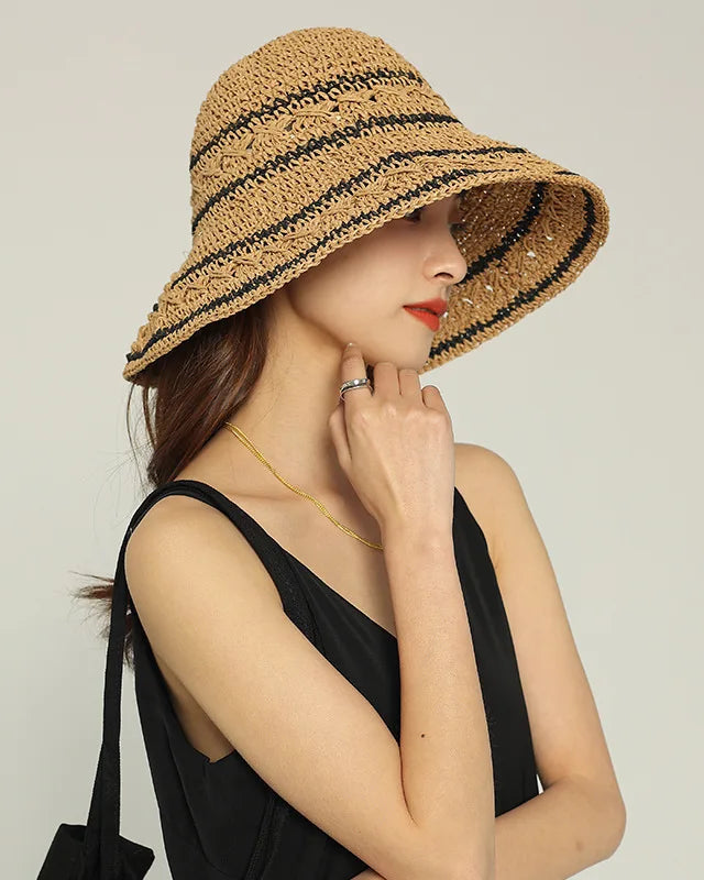 Woven straw visor hat. Lightweight, breathable open-crown design with wide brim — perfect for beach, travel, summer outdoor wear. 