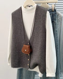 This open-front knit vest brings a relaxed, contemporary aesthetic to everyday layering — its full-opening button construction allows it to be styled as a lightweight outer layer or worn as a structured mid-piece beneath a coat. 