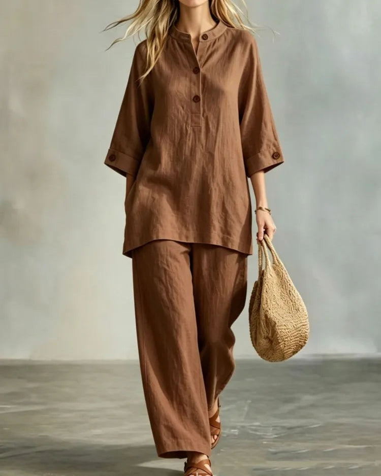O-neck 3/4 sleeve button top and ankle-length trouser 2-piece set. Loose, solid-colour acetate — elegant resort casual style for spring and summer.