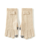Pure cashmere wrist gloves with touchscreen-compatible fingertips. Luxuriously soft, elegantly knit, and designed for the modern woman. 