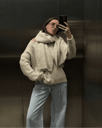 A Loose Soft V-Neck Sweater With A Scarf