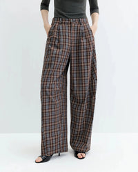 The high waist lends a clean line while the wide leg allows for effortless movement, a quietly versatile piece meant to anchor a minimal, considered wardrobe.