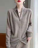 Clean lines give this wool zip cardigan an understated presence. A stand collar frames the neckline, while long raglan sleeves create a gently rounded profile.