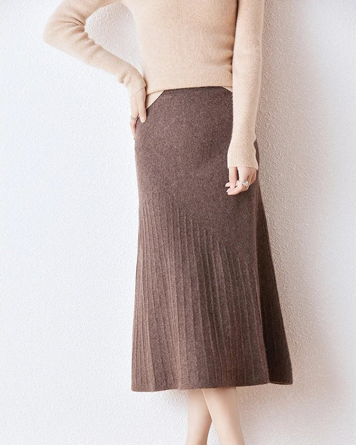 Women's wool knitted high-waist A-line skirt featuring a flattering empire waist, mid-calf length, and elegant drape, perfect for office wear or formal autumn occasions.