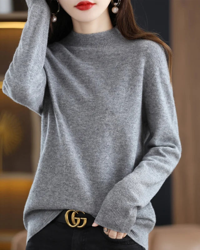 A mock neck sweater in extrafine merino wool with a slim fit, knitted from a single unjoined thread for soft warmth and versatile layering.