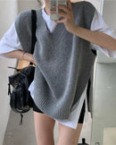 Wool blend V-neck solid loose sleeveless knit vest. No stretch and relaxed fit — a casual elegant autumn winter knitwear top for women.