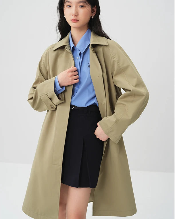 Solid lapel single-breasted pocket A-line mid-length trench coat. Simple, casual, and elegant — a chic office-style spring autumn outerwear for women.