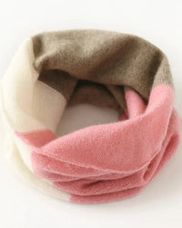 A quiet statement in winter accessories, this cashmere neck warmer offers a delicate knit texture, comfortable warmth, and an easy looped shape.