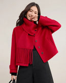 A wool coat featuring a detachable fringed scarf collar, drop shoulders, and welt pockets, designed for a versatile, warm winter look.