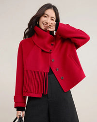 A wool coat featuring a detachable fringed scarf collar, drop shoulders, and welt pockets, designed for a versatile, warm winter look.