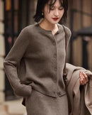  A pure cashmere round neck cardigan with a button front, designed for lightweight luxury that layers easily over tees and dresses for office or weekend wear.