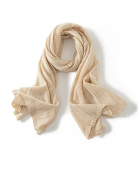 The pashmina inspired form is finished with openwork texture and delicate tassels, creating understated character.