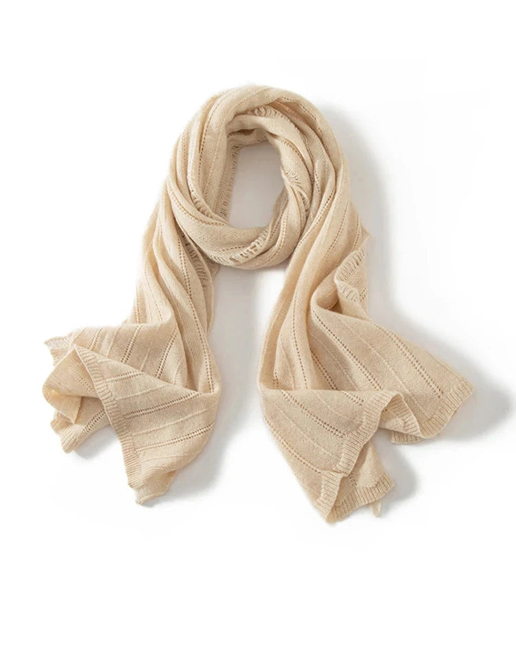 The pashmina inspired form is finished with openwork texture and delicate tassels, creating understated character.