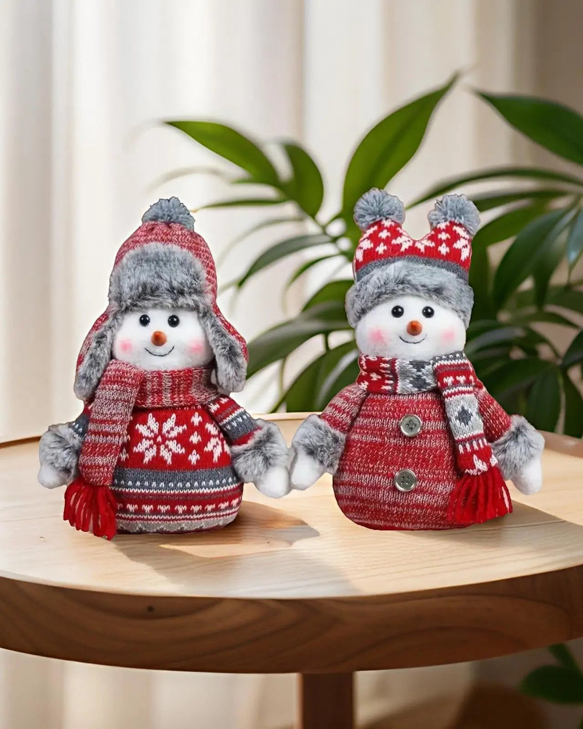 This decorative snowman pairs knitted accessories with a rounded body and a friendly smile.