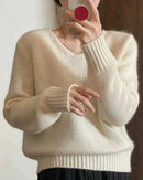 A V-neckline frames the look with understated definition, while the loose cut makes layering feel effortless.