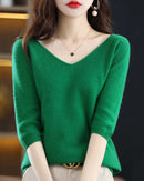 100% merino wool V-neck short sleeve pullover for women. Lightweight, anti-pilling solid knit in 6 colors — effortless style for spring & summer.