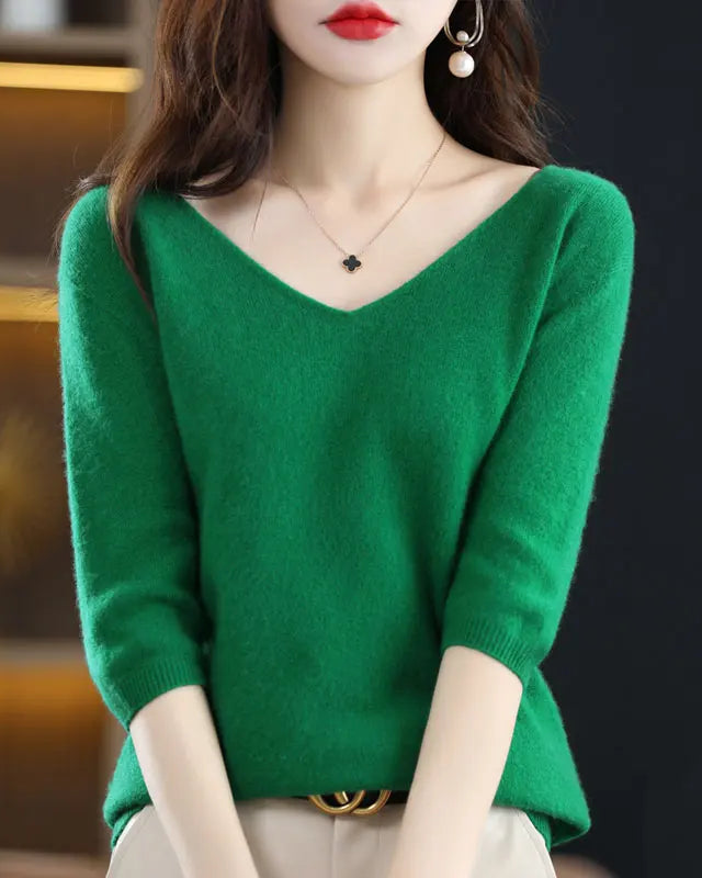 100% merino wool V-neck short sleeve pullover for women. Lightweight, anti-pilling solid knit in 6 colors — effortless style for spring & summer.