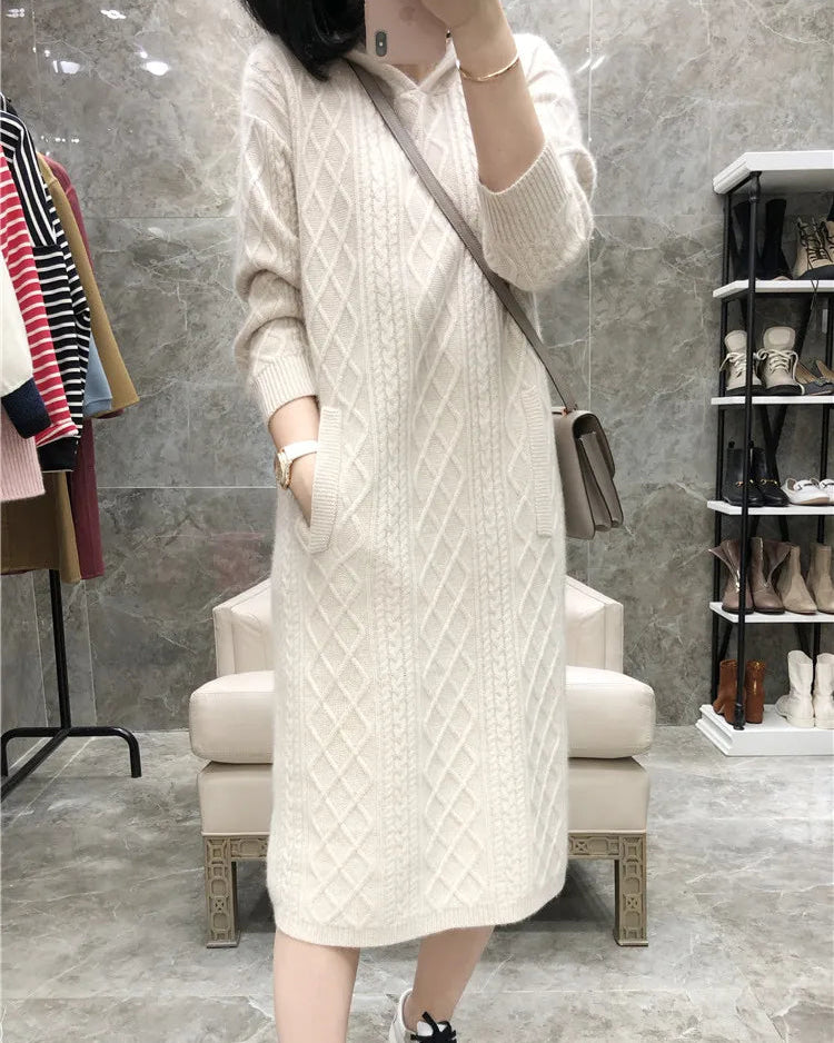 Cable-knit cashmere hooded sweater dress for women with diamond texture, hood, and front patch pockets, a warm fall-winter pullover dress for casual everyday wear.