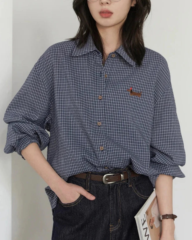 The single-breasted closure, turn-down collar, and relaxed shape create an effortless balance of structure and ease, while the smooth fabric sits comfortably through the day.