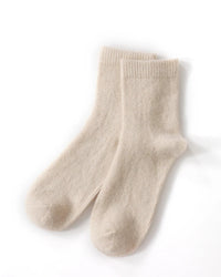 Knitted entirely from cashmere — one of the world's finest natural fibres — they offer a level of softness and warmth that synthetic alternatives simply cannot replicate. 