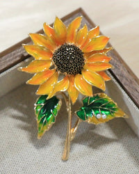 Exquisite baroque sunflower brooch in gold tone, ornate metal pin with layered petals and detailed center, perfect for adding vintage floral charm.