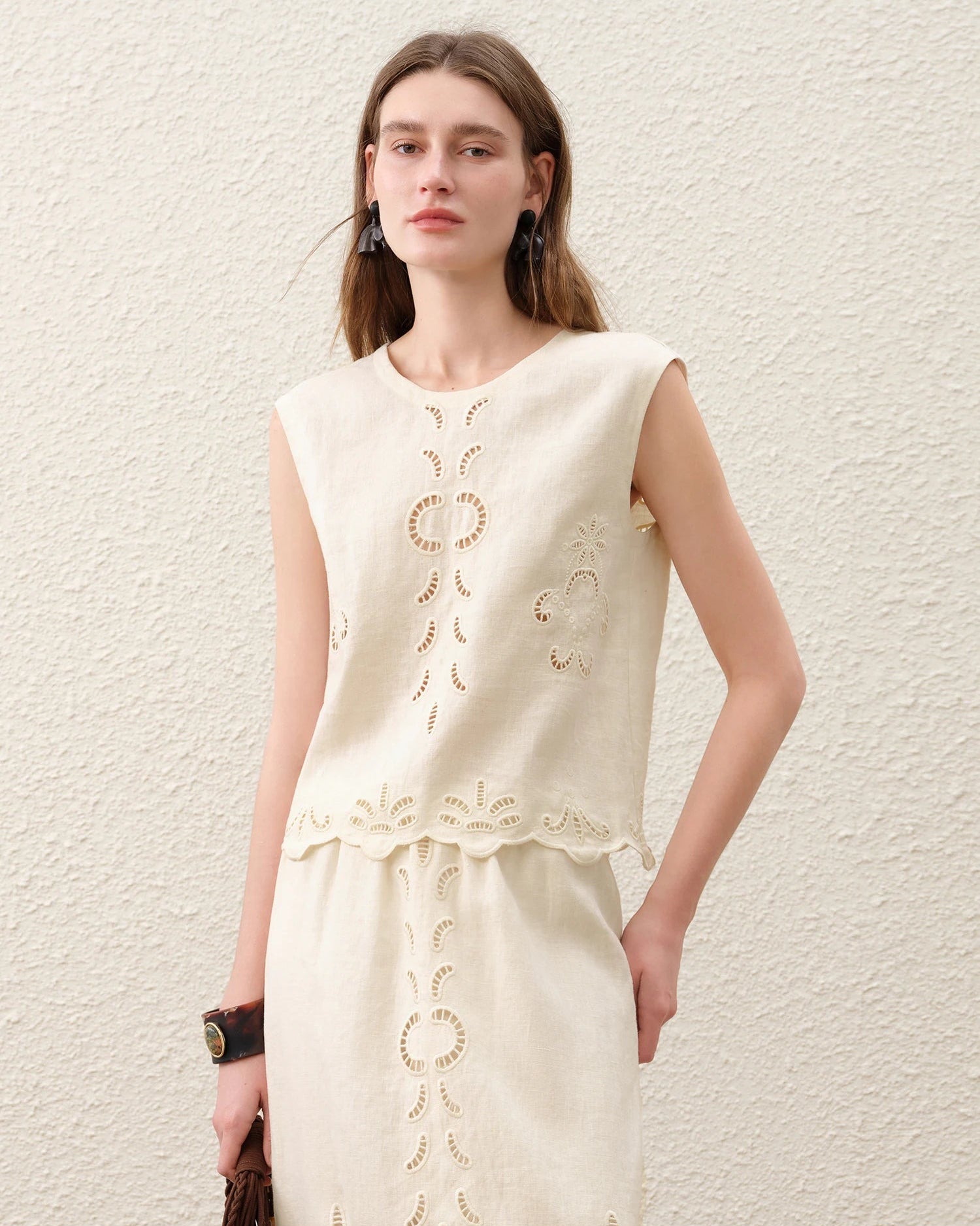 Women's Linen cut-out embroidered sleeveless top crafted from 100% breathable linen, featuring delicate artisan details and an O-neck silhouette for poised ease from beach lounging to resort dining.