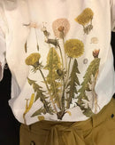 Women's  dandelion botanical print T-shirt featuring a vintage plant graphic, breathable cotton knit, and an oversized fit for hiking, outdoor, and casual wear.