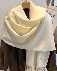 A faux cashmere tassel wrap scarf featuring a thick, windproof weave and a generous 70x200cm drape for versatile, elegant warmth.